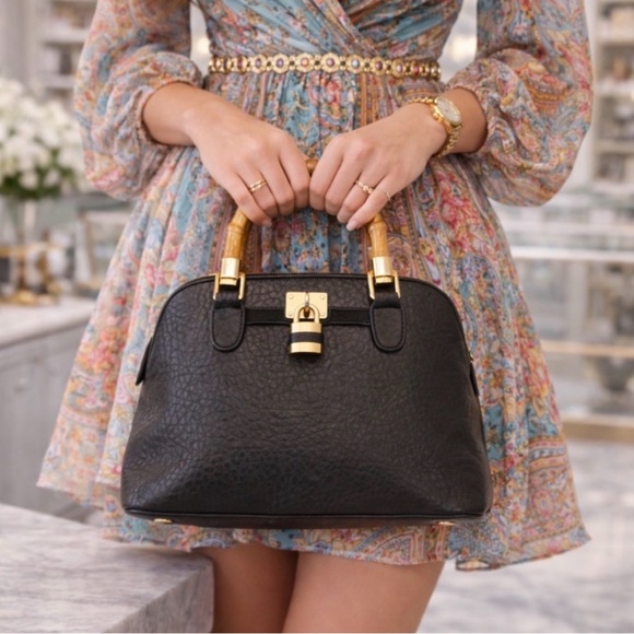 Elegant Black Pebbled Handbag with Bamboo Handles - Picture 2 of 5